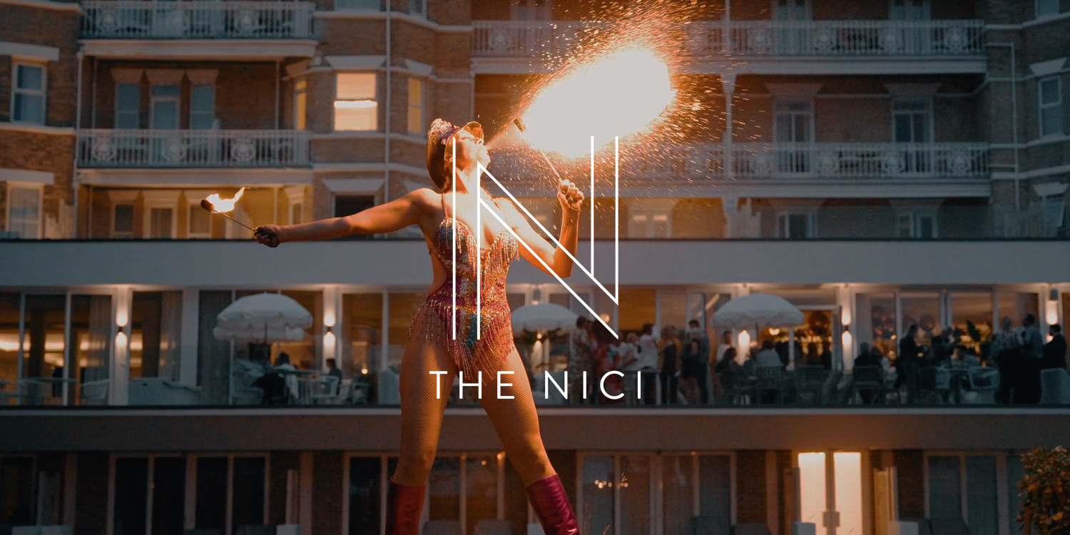 The Nici launch party - see a girl breathing fire with a hotel in the background